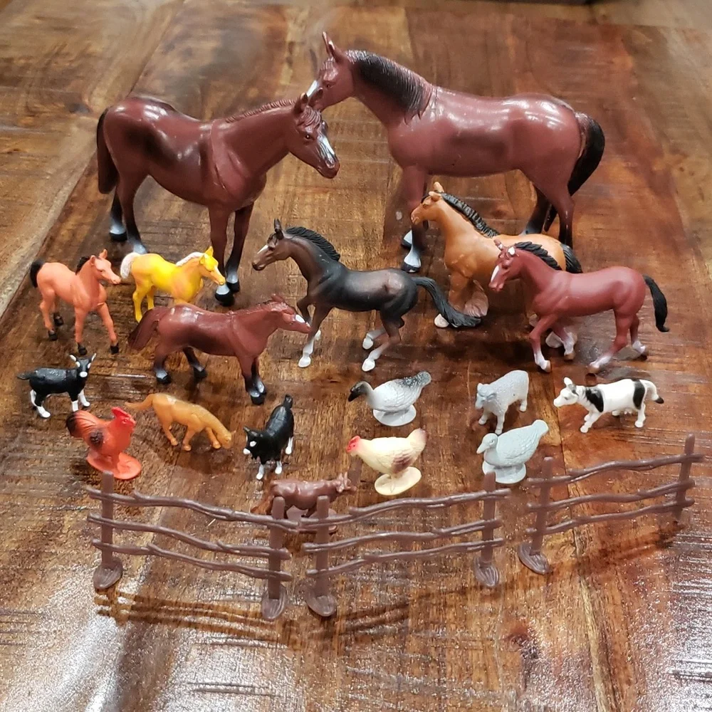 Set of toy horses and farm animals